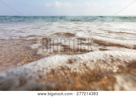 Low Angle, Camera On The Ground, Lens Covered With Water Drops To Emphasise Wetness - Close Up Of Sh