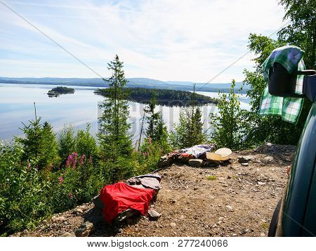 Camper Van Motor Home On Fjord Lake Shore In Summer. Camping On Norwegian Nature. Holidays And Trave