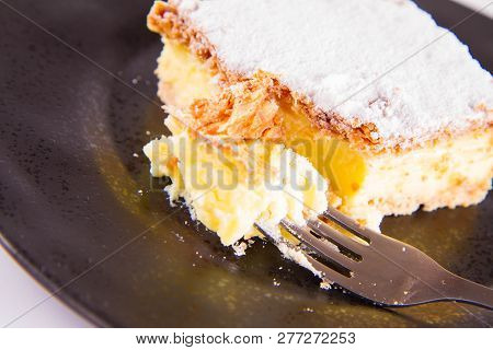 Napoleonka Cake - A Polish Type Of Cream Pie - Sprinkled With Powdered Sugar, Eaten With A Fork