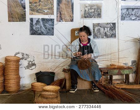 Camacha, Madeira, Portugal - April 19, 2018: A Basket Weaver At Work In The Factory Shop In Camacha 