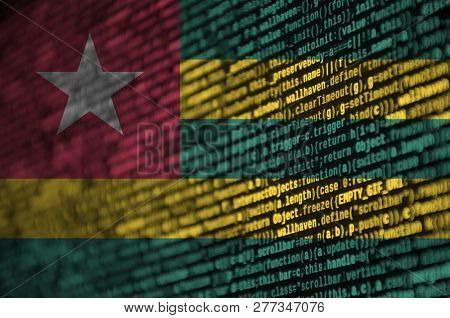 Togo Flag  Is Depicted On The Screen With The Program Code. The Concept Of Modern Technology And Sit
