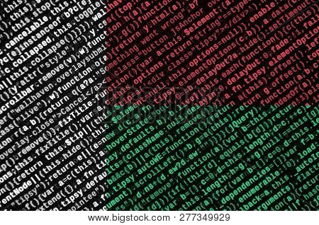 Madagascar Flag  Is Depicted On The Screen With The Program Code. The Concept Of Modern Technology A