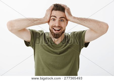 No Way You Gotta Be Kidding Me. Happy Amazed And Surprised Thrilled Handsome Man With Beard In Olive