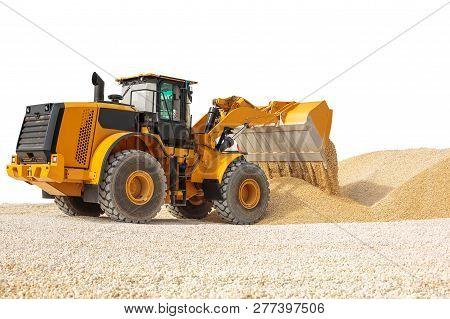 Working Bulldozer On A Building Site Isolated With Clipping Path. Modern Wheel Loader Isolated.