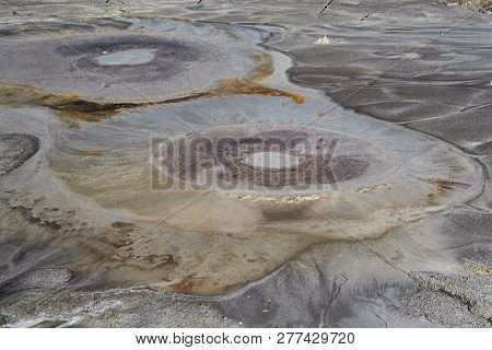 Bubbles Of Mud Exiting From Earth From A Mud Volcano In Berca, Romania.