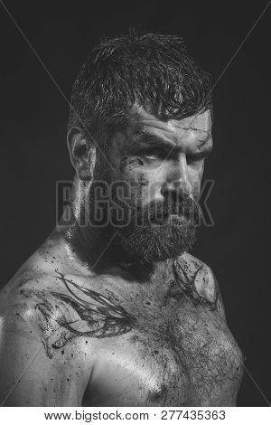 Hipster With Beard, Mustache On Serious Dirty Face. Bearded Man With Tattoo On Chest Skin. Wizard, S