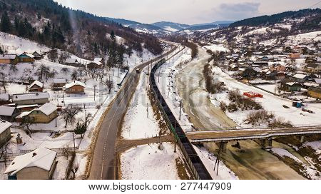 Train And Bus Moving In Winter Valley