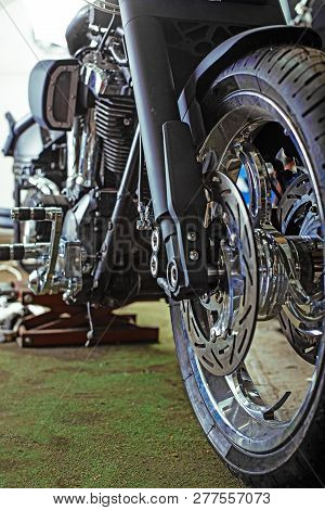 Cropped Close Up Shot Of Beautiful And Custom Made Motorcycle In The Workshop