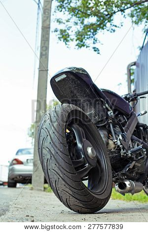 Cropped Close Up Shot Of Beautiful And Custom Made Motorcycle Parked On The Street