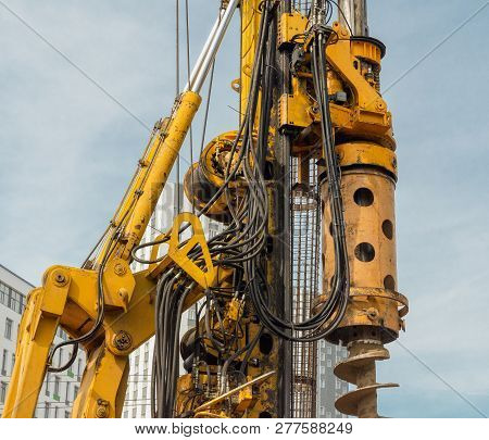 Concrete Drilling Machine. Hydraulic Drilling Machine Is Boring Holes In The Construction Site For B