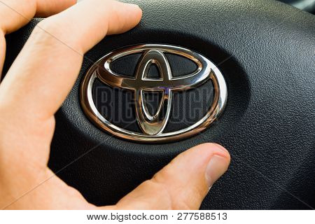 August 25, 2018. Krasnoyarsk. Russia. Toyota Logo In Male Hand