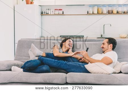 A Woman And A Man Watch Tv