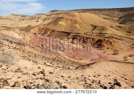 Colored sands in the Makhtesh Gadol erosion crater in the desert in Israel