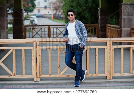 Stylish Indian Young Man At Sunglasses Wear Casual Posed Outdoor.