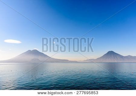Atitlan, Toliman & San Pedro Volcanoes In Early Morning Light On Lake Atitlan In Guatemalan Highland