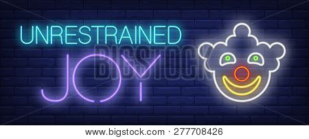Unrestrained Joy Neon Text With Smiling Clown Face. Circus Performance Advertisement Design. Night B