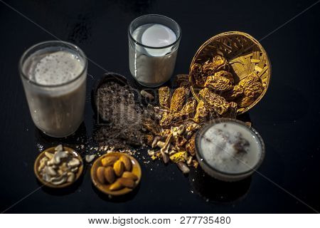 Close Up Of Popular Indian And Asian Winter Drink On Wooden Surface I.e. Kharek Ka Dudh Or Dried Dat