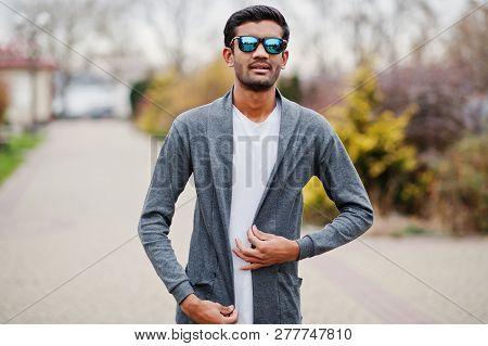Stylish Indian Man At Sunglasses Wear Casual Posed Outdoor.