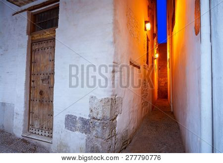 Albaicin of Granada narrow street at sunset of Andalusia muslim Spain