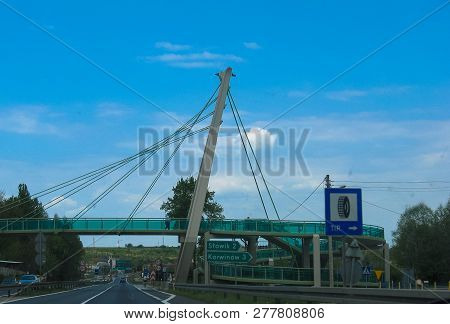 Korwinow, Poland - May 01, 2014: Glass Pedestrian Bridge Over The Road