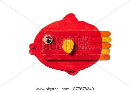 Figure Of A Colorful Red Fish Made Of Wood By A Child, White Background