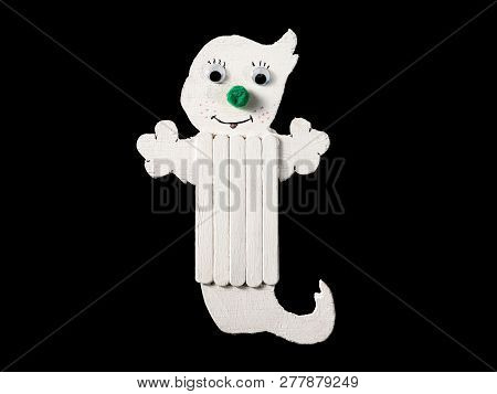 Figure Of A Funny White Ghost Made Of Wood By A Child, Black Background