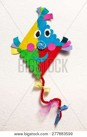 A Colorful Kite Made Of Wood By A Child, White Background