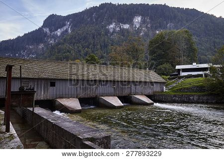 Dam On The Water Of Lake Koenigssee In Germany