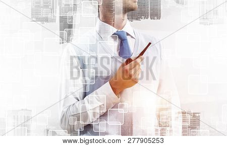 Confident And Young Businessman In Smart-casual Wear Smoking Pipe And Modern Cityscape With Business