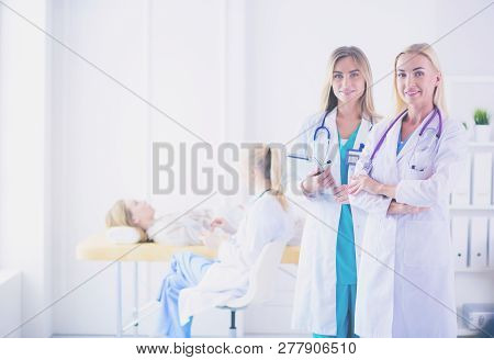 Portrait Of Female Standing Near Open Fridge Full Of Healthy Food, Vegetables And Fruits. Portrait O