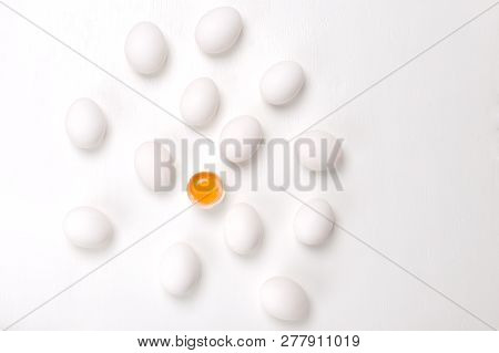 Eggs Fresh, Unharmed And One Broken Egg With Yellow Yolk On A White Background.healthy Eating Concep