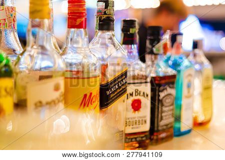 Pattaya, Thailand - 26 December 2018 - Bottles Of Liquor In Various Shapes And Sizes Line Up On Coun