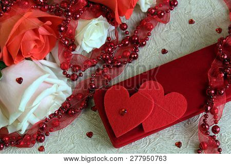 Pink And White Roses, With Red Beads, Two Hearts And A Box With A Gift, On A Light Background For Th