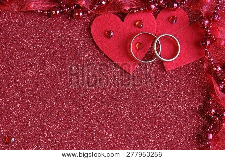 Background For A Postcard Of Love And Two Hearts And Wedding Rings, With The Effect Of Blur