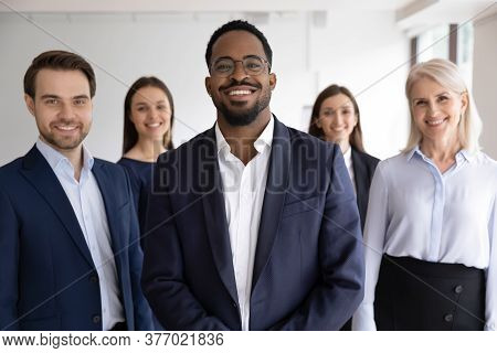 Portrait Of Diverse Staff Lead By African Leader Photoshooting Indoor