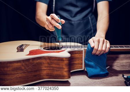 Modify Acoustic Guitar, Guitar Repairman Is Working, Close-up.