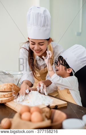 Mom Teaching Son For Cooking Food. Mother And Kid Daily Lifestyle At Home. Asian Family Together In 