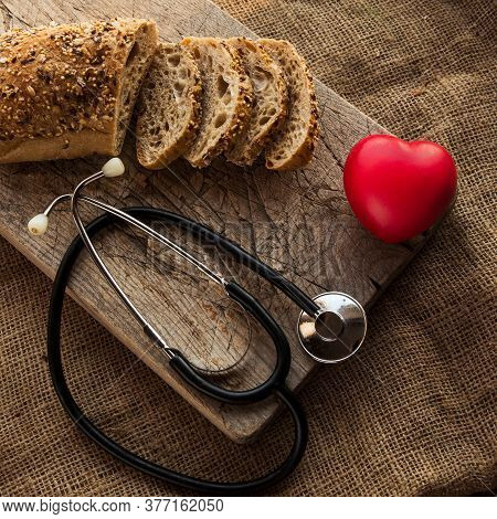 Gluten Free Bread On Cutting Board With Heart Shape Figure As A Concept Of Special Meal For People O