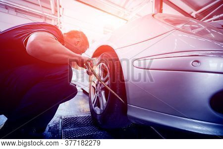 Automotive Suspension Test And Brake Test Rolls In A Auto Repair Service.