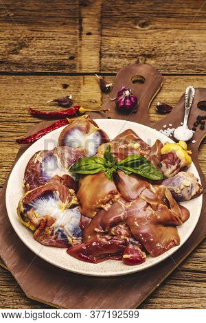 Fresh Raw Chicken Offal: Heart, Liver, Stomach With Dry Spices, Sea Salt, Chili Pepper On Wooden Tab