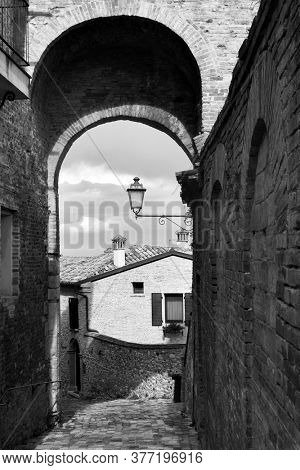 Medieval street in Santarcangelo di Romagna town, Rimini Province, Italy. Black and white cityscape