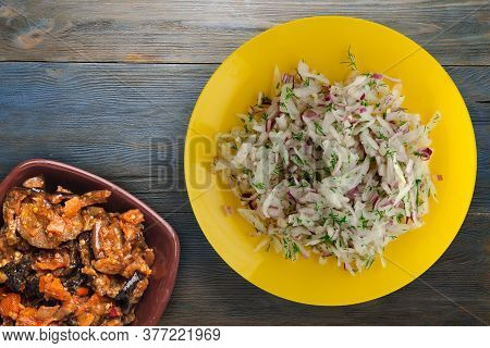 Salad Daikon, Onions And Dill On Blue Grey Wooden Background. Salad On Yellow Plate With Vegetarian 