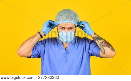 Beginning Of Virus Outbreak. Man Doctor Uniform Yellow Background. Type Of Virus. Coronavirus Concep