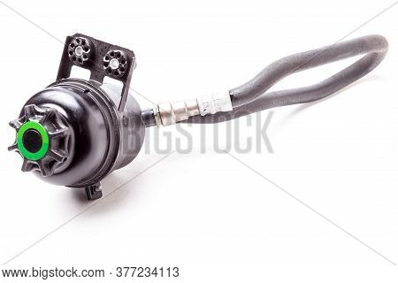 Car Spare Part - Used Plastic Black Tank Of Power Steering Oil Fluid On A White Isolated Background 
