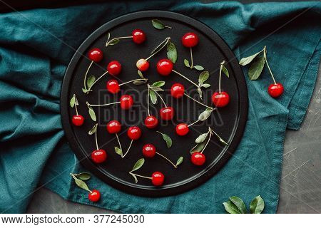 Ripe Cherries On A Black Dish. Cottagecore Aesthetics. Rustic, Vintage Style Harvest Season Concept