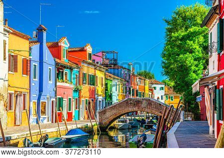 Colorful Houses Of Burano Island. Multicolored Buildings On Fondamenta Embankment Of Narrow Water Ca