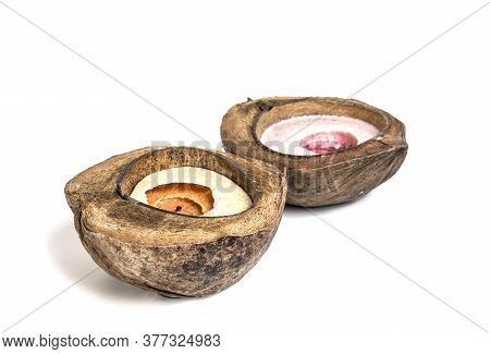 Candle In Coconut Isolated On White Background