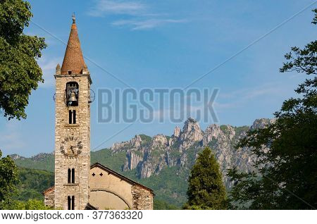 Scenic View Of The Santo Stefano Church Of Tesserete With The Denti Della Vecchia Moutain Range In T