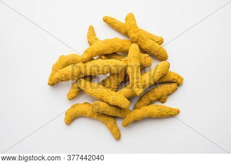 Haldi Or Dried Turmeric Roots As A Whole On White Background