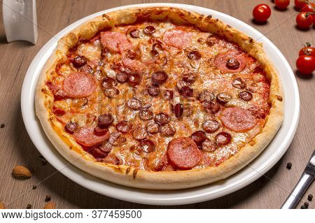 Pizza Is Super Meat Thin Cake, Tomato Sauce, Beef Balyk, Ham, Bacon, Hunting Sausages Italian Salami